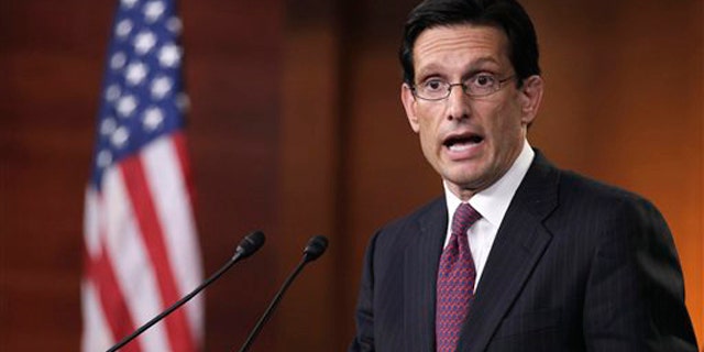House Majority Leader Eric Cantor gestures during a news conference on Capitol Hill April 7.