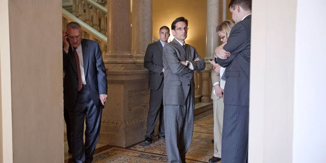 House Majority Leader Eric Cantor of Va., center, Senate Minority Leader Jon Kyl of Ariz., left, and others, are seen on Capitol Hill in Washington, Thursday, June 9, 2011, following a meeting on the debt ceiling. (AP)