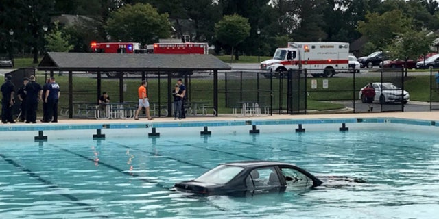 Officials say the man and the woman inside the car were able to get out safely.
