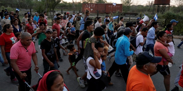 Central American migrants take part in a march along a street in the city as they take a pause from traveling in their caravan, during their journey to the U.S., in Matias Romero, Mexico April 3, 2018.