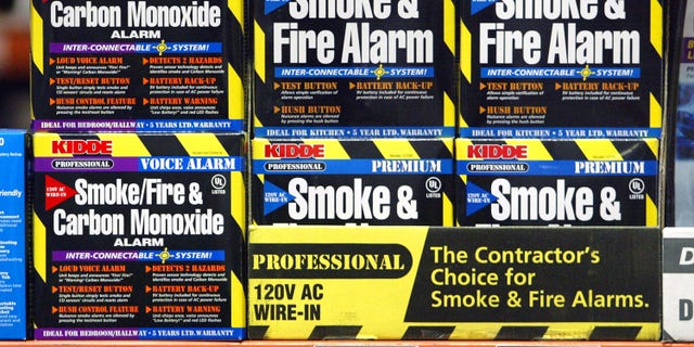 MOUNT PROSPECT, IL - FEBRUARY 19: Smoke, Fire & Carbon Monoxide alarms are displayed in a Home Depot store February 19, 2004 in Mount Prospect, Illinois. United States Consumer Product Safety Commission reports that about 125 carbon-monoxide-related deaths occur each year. (Photo by Tim Boyle/Getty Images)
