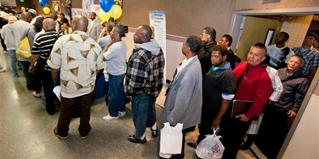 Job seekers line up at the 10th annual Skid Row Career Fair held at the Los Angeles Mission in downtown Los Angeles June 2.