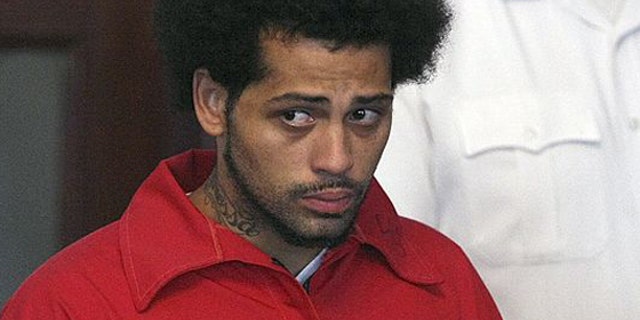 Carlos Ortiz was arraigned on weapons charges on June 28, 2013.
