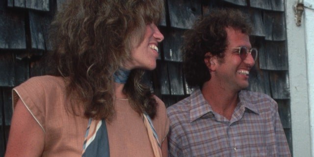 Singer Carly Simon and her brother Peter Simon during a book signing for Peter Simon's book "On the Vineyard" in 1980.