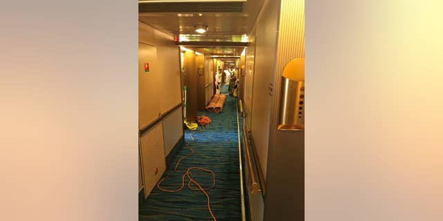 A photo provided by Carnival Cruise Lines appears to show Deck 9 after cleanup.