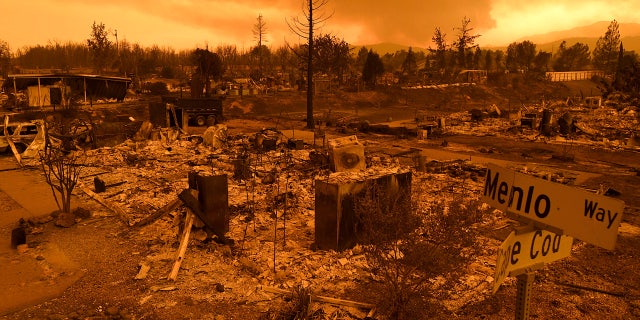 Homes leveled by the Carr Fire line the Lake Keswick Estates area of Redding, Calif.