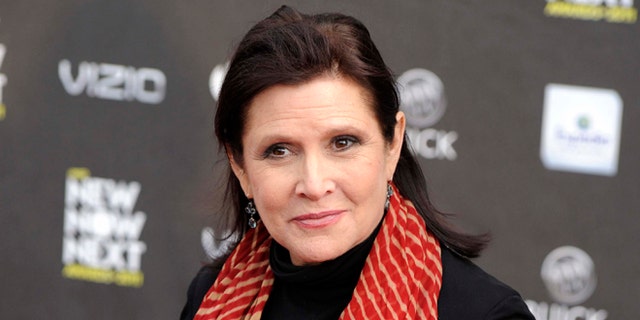 FILE - This April 7, 2011 file photo shows Carrie Fisher at the 2011 NewNowNext Awards in Los Angeles. Lucasfilm, the company behind Star Wars, says there are no plans to digitally recreate the late Carrie Fisher to play Princess Leia in future episodes of the movie saga. The Disney-owned Lucasfilm made the rare foray into the world of Star Wars speculation Friday, Jan. 13, 2017 by issuing the statement denying any plans to digitize Fisher, who died Dec. 27. (AP Photo/Chris Pizzello, File)