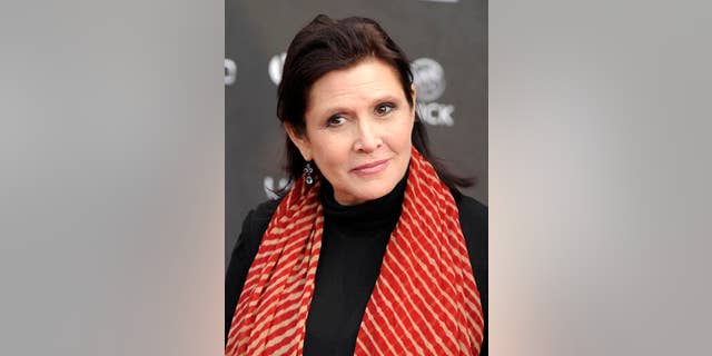 FILE - In this Thursday, April 7, 2011 file photo, Carrie Fisher arrives at the 2011 NewNowNext Awards in Los Angeles. On Tuesday, Dec. 27, 2016, a publicist said Fisher has died at the age of 60. (AP Photo/Chris Pizzello, File)