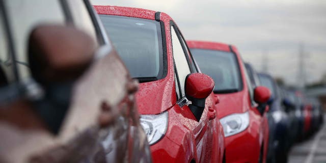 DAGENHAM, ENGLAND - JANUARY 13: Cars are prepared for distribution at a Ford factory on January 13, 2015 in Dagenham, England. Originally opened in 1931, the Ford factory has unveiled a state of the art GBP475 million production line that will start manufacturing the new low-emission, Ford diesel engines from this November this will generate more than 300 new jobs, Ford currently employs around 3000 at the plant in Dagenham. (Photo by Carl Court/Getty Images)