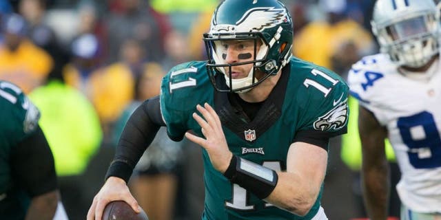 Jan 1, 2017; Philadelphia, PA, USA; Philadelphia Eagles quarterback Carson Wentz (11) runs with the ball against the Dallas Cowboys during the third quarter at Lincoln Financial Field. Mandatory Credit: Bill Streicher-USA TODAY Sports