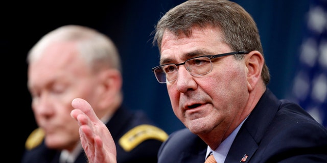 April 16, 2015: Defense Secretary Ash Carter, right, accompanied by Joint Chiefs Chairman Gen. Martin Dempsey, speaks during a news conference at the Pentagon.