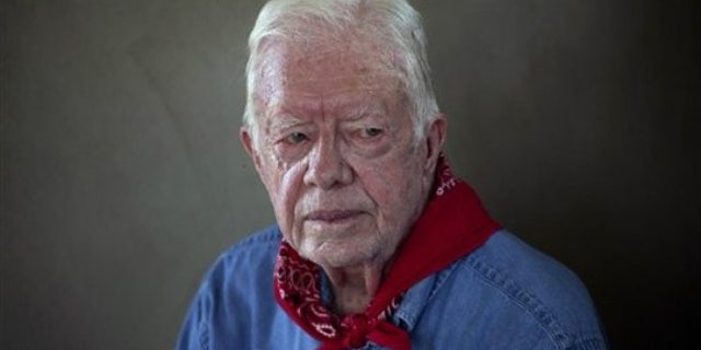 Nov. 7, 2011: Former U.S. President Jimmy Carter pauses during an interview, while on a visit to a Habitat for Humanity project in Leogane, Haiti.