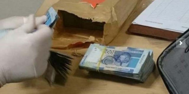 Cash seized at OR Tambo International Airport. (South African Revenue Service)