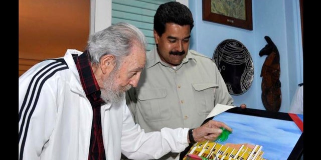 Venezuela's President Nicolas Maduro with Cuba's former President Fidel Castro during their meeting at Havana, Cuba