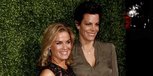 In this Jan. 6, 2011 file photo, Cat Cora, left, and Jennifer Cora arrive at the Oprah Winfrey Network Television Critics Association 2011 Winter Press Tour Cocktail Reception in Pasadena, Calif.