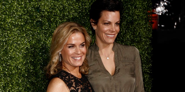 In this Jan. 6, 2011 file photo, Cat Cora, left, and Jennifer Cora arrive at the Oprah Winfrey Network Television Critics Association 2011 Winter Press Tour Cocktail Reception in Pasadena, Calif.
