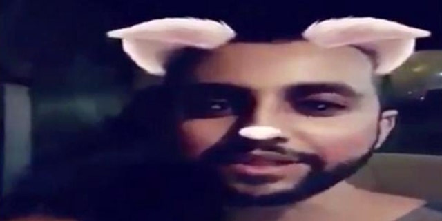 Image from a video showing a man killing at least three cats in Saudi Arabia.