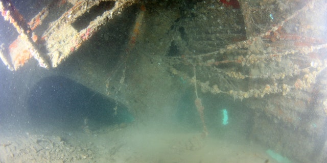 Silted interior of the fuselage in the area of the mechanic’s compartment. (Credit UH Marine Option Program)