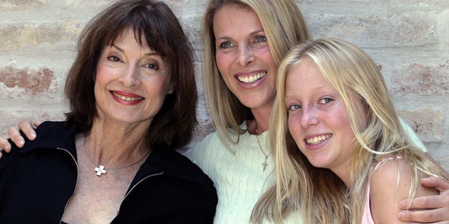 Member of Serbia's royal family Princess Jelisaveta Karadjordjevic (L) poses for a picture with her daughter U.S. actress Catherine Oxenberg (C) and grand daughter India (R) at her home in Belgrade's suburb of Zemun June 11, 2004.