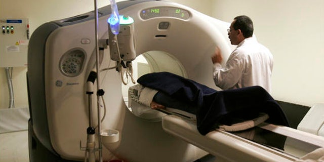 A patient is put through a cat scan machine in Kingston, N.Y.
