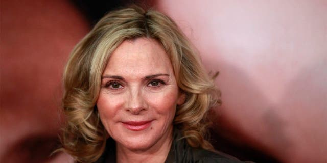 Actress Kim Cattrall arrives for the premiere of the film "The Five-Year Engagement" to begin the 2012 Tribeca Film Festival in New York, April 18, 2012. The premiere of the film starring Jason Segel and Blunt, by the same team behind "Forgetting Sarah Marshall," kicked off the festival which is entering its second decade with organizers promising a broader quality of films from all regions of the world. REUTERS/Lucas Jackson (UNITED STATES - Tags: ENTERTAINMENT) - GM1E84J0WKP01