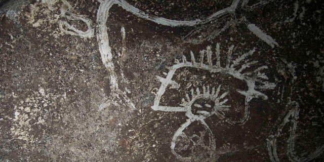 Indigenous rock art from Mona island. Note how the artist uses the contrast between the darker cave wall and the white design (Project El Corazon del Caribe)