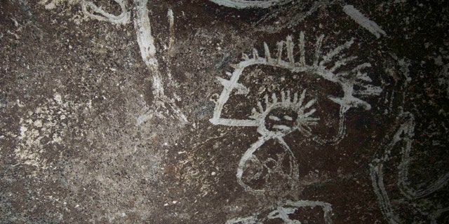 Indigenous rock art from Mona island. Note how the artist uses the contrast between the darker cave wall and the white design (Project El Corazon del Caribe)