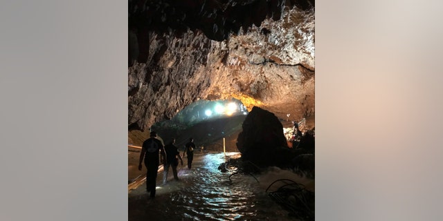 This photo tweeted by Elon Musk shows efforts underway to rescue trapped members of a youth soccer team from a flooded cave in northern Thailand.