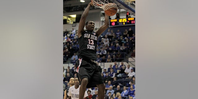 San Diego State's Winston Shepard scores against Air Force during an NCAA basketball game at Air Force Academy, Colo., Saturday, Feb. 2, 2013. (AP Photo/Brennan Linsley)
