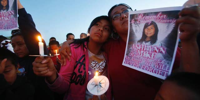 May 4, 2016: Klandre Willie, left, and her mother, Jaycelyn Blackie, participate in a candlelight vigil for Ashlynne Mike at the San Juan Chapter House in Lower Fruitland, N.M. The FBI said Ashlynne was abducted after school and her body was found the next day. The death of the young Navajo Nation girl is fueling efforts to create an Amber Alert plan on the vast reservation.