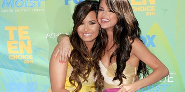 August 07, 2011: Actresses/singers Demi Lovato and Selena Gomez arrive at the 2011 Teen Choice Awards held at the Gibson Amphitheatre in Universal City, Calif.