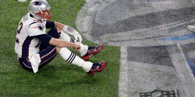 New England Patriots quarterback Tom Brady sits on the field after fumbling against the Philadelphia Eagles during the second half of the NFL Super Bowl 52 football game Sunday, Feb. 4, 2018, in Minneapolis. (AP Photo/Eric Gay)