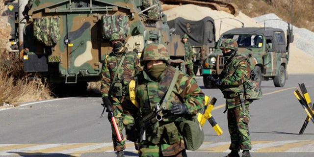 Nov. 29: South Korean marines guard Yeonpyeong island, South Korea.