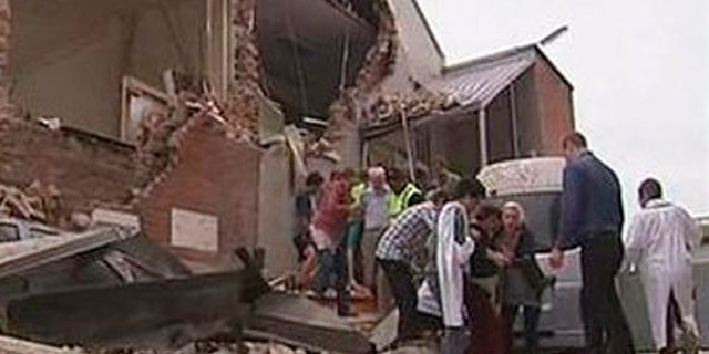 Feb. 22: People are evacuated from a damaged building after an earthquake in Christchurch, New Zealand.