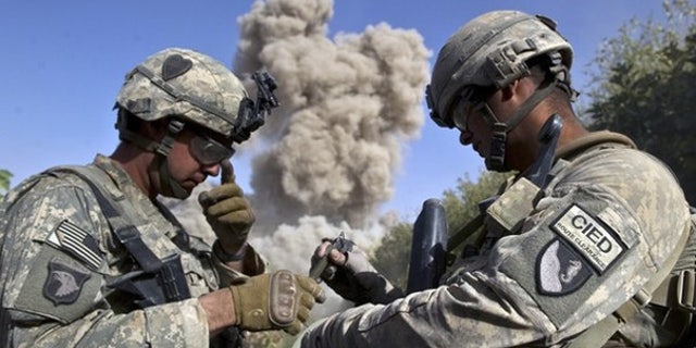 Oct. 25: U.S. soldiers blow up a building they believe the Taliban may use in Kandahar, Afghanistan.