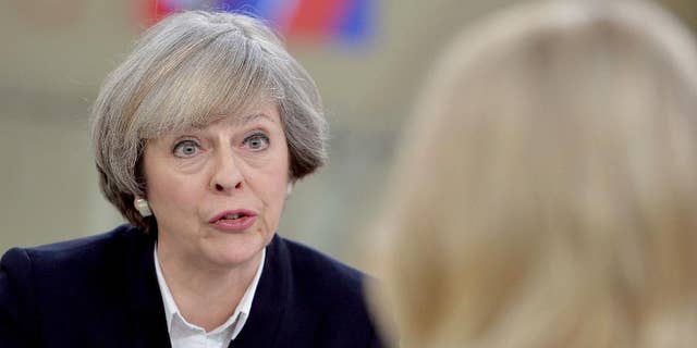 Britain's Prime Minister Theresa May, left, is interviewed by Sophy Ridge for a television channel, in London, Sunday Jan.  8, 2017. May said Sunday she will announce details of Britain's European Union exit plans in the next few weeks, and denied a former diplomat's claim that the government is "muddled" about Brexit. (John Stillwell/PA via AP)