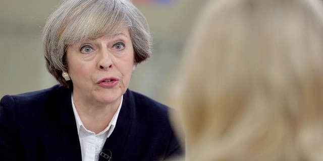 Britain's Prime Minister Theresa May, left, is interviewed by Sophy Ridge for a television channel, in London, Sunday Jan. 8, 2017. May said Sunday she will announce details of Britain's European Union exit plans in the next few weeks, and denied a former diplomat's claim that the government is "muddled" about Brexit. (John Stillwell/PA via AP)