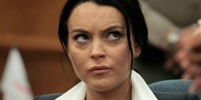 May 24: Lindsay Lohan sits in the courtroom during her hearing in Beverly Hills.