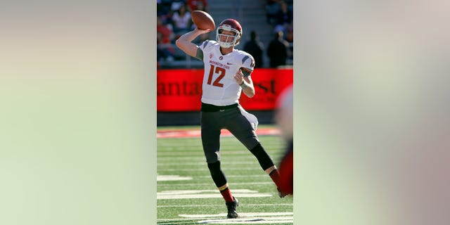 Washington State's quarterback Connor Halliday throws against Arizona in the second half of an NCAA college football game on Saturday, Nov. 16, 2013, in Tucson, Ariz. Washington State won 24 - 17. (AP Photo/John MIller)