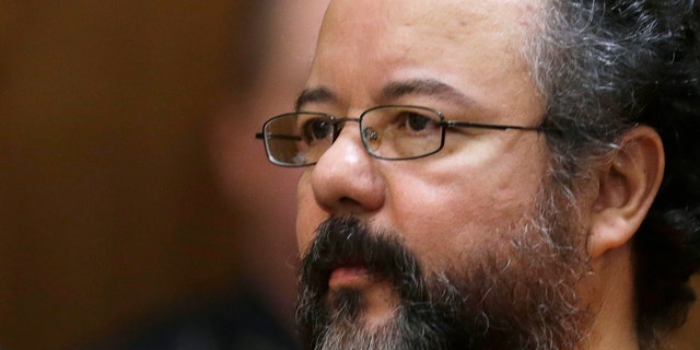 FILE - This Aug. 1, 2013 file photo shows Ariel Castro in the courtroom during the sentencing phase in Cleveland. A report from prison guards released Tuesday, Oct. 15, 2013 by the Ohio Department of Rehabilitation and Correction provides more details about the death of Cleveland kidnapper Ariel Castro, but they offer few additional clues about whether he meant to kill himself or was strangled accidentally while performing a sex act.   (AP Photo/Tony Dejak, File)