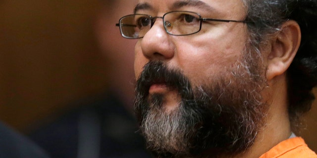 FILE - This Aug. 1, 2013 file photo shows Ariel Castro in the courtroom during the sentencing phase in Cleveland. A report from prison guards released Tuesday, Oct. 15, 2013 by the Ohio Department of Rehabilitation and Correction provides more details about the death of Cleveland kidnapper Ariel Castro, but they offer few additional clues about whether he meant to kill himself or was strangled accidentally while performing a sex act. (AP Photo/Tony Dejak, File)