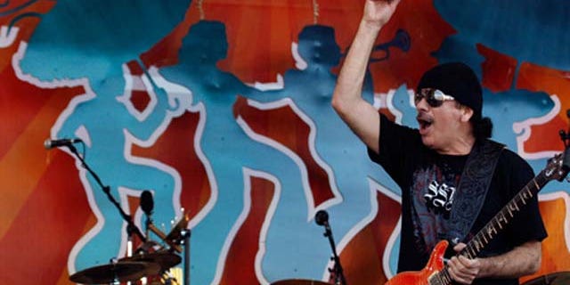 May 04, 2008: Carlos Santana performs during the New Orleans Jazz and Heritage Festival at the Fair Grounds Race Course in New Orleans, LA.