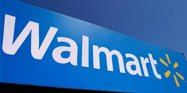 FILE - In this May 16, 2011 file photo, the Walmart logo is displayed on a store in Springfield, Ill. The retail giant won a legal victory Monday, March 28,2 016 in a fight over taxation by Puerto Rico's government when a federal judge in the U.S. island territory ruled that a modified tangible-property tax is invalid. The ruling was issued as the island rushes to find new sources of revenue and a debt restructuring mechanism from the U.S. Congress while struggling through a decade-long economic crisis. The government says it will appeal the decision. (AP Photo/Seth Perlman, File)