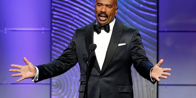 TV host Steve Harvey presents the outstanding morning program award during the 40th annual Daytime Emmy Awards in Beverly Hills, California June 16, 2013. Harvey hosts "Family Feud."