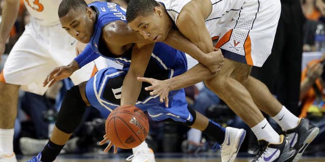 Duke's Rasheed Sulaimon, left, and Virginia's Malcolm Brogdon, right, chase a loose ball during the first half of an NCAA college basketball game in the championship of the Atlantic Coast Conference tournament in Greensboro, N.C., Sunday, March 16, 2014. (AP Photo/Gerry Broome)
