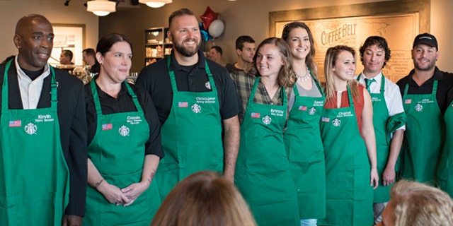 A group of newly-hired veterans pictured at a Starbucks' Military Family Store in Norfolk, Virginia.