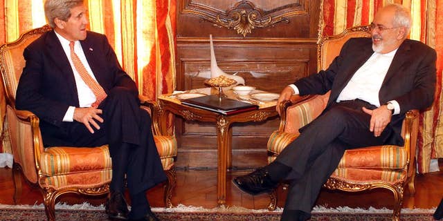 U.S. Secretary of State John Kerry, left, meets with Iran's Foreign Minister Mohammad Javad Zarif, Monday, April 27, 2015, in New York. Kerry and Zarif are both in New York to attend a United Nations conference on nuclear non-proliferation. (AP Photo/Jason DeCrow, Pool)