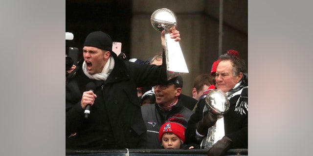 New England Patriots quarterback Tom Brady and head coach Bill Belichick hold Super Bowl trophies during a rally Tuesday, Feb. 7, 2017, in Boston to celebrate Sunday's 34-28 win over the Atlanta Falcons in the NFL Super Bowl 51 football game in Houston. (Barry Chin /The Boston Globe via AP, Pool)