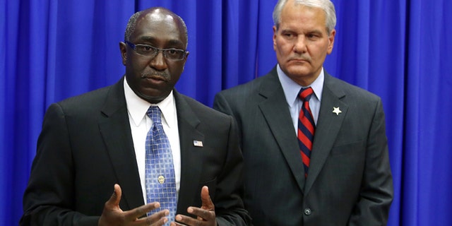 Sanford Police Chief Cecil Smith, left, addresses the media with Seminole County Sheriff Donald Eslinger.