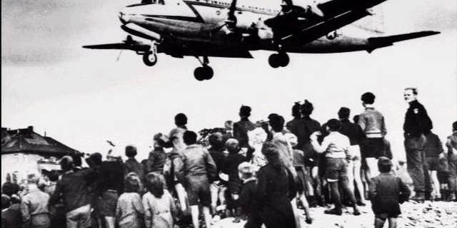 U.S. Air Force C-54 Skymaster aircraft lands at Berlin Tempelhof Airport during the Berlin Airlift, June 6, 1948. The Berlin Airlift was prompted by the Soviet's Berlin Blockade, one of the first international crises of the Cold War. 